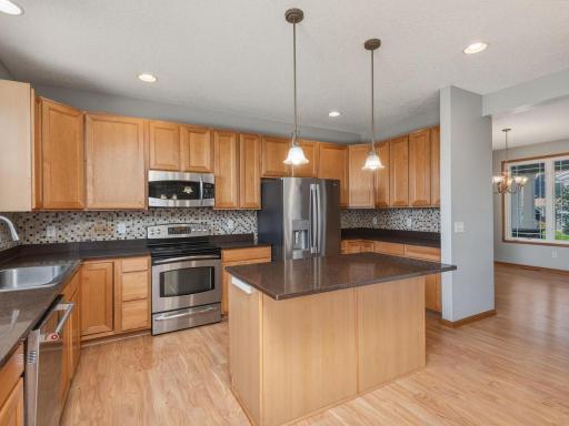 The kitchen flows seamlessly to both the more informal & formal dining spaces.