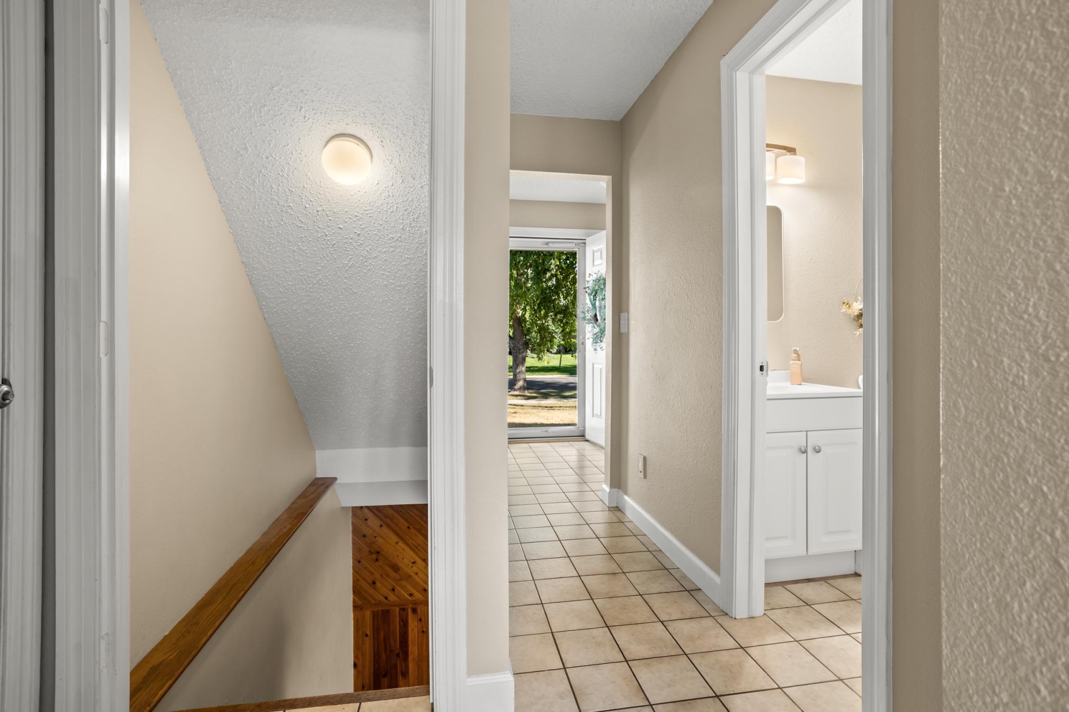 Stairwell to basement - view to front door