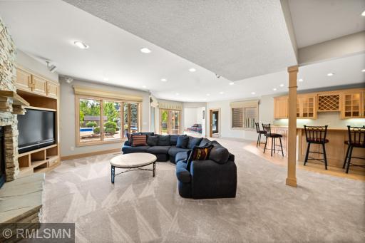 Expansive lower-level walks out to the pool area