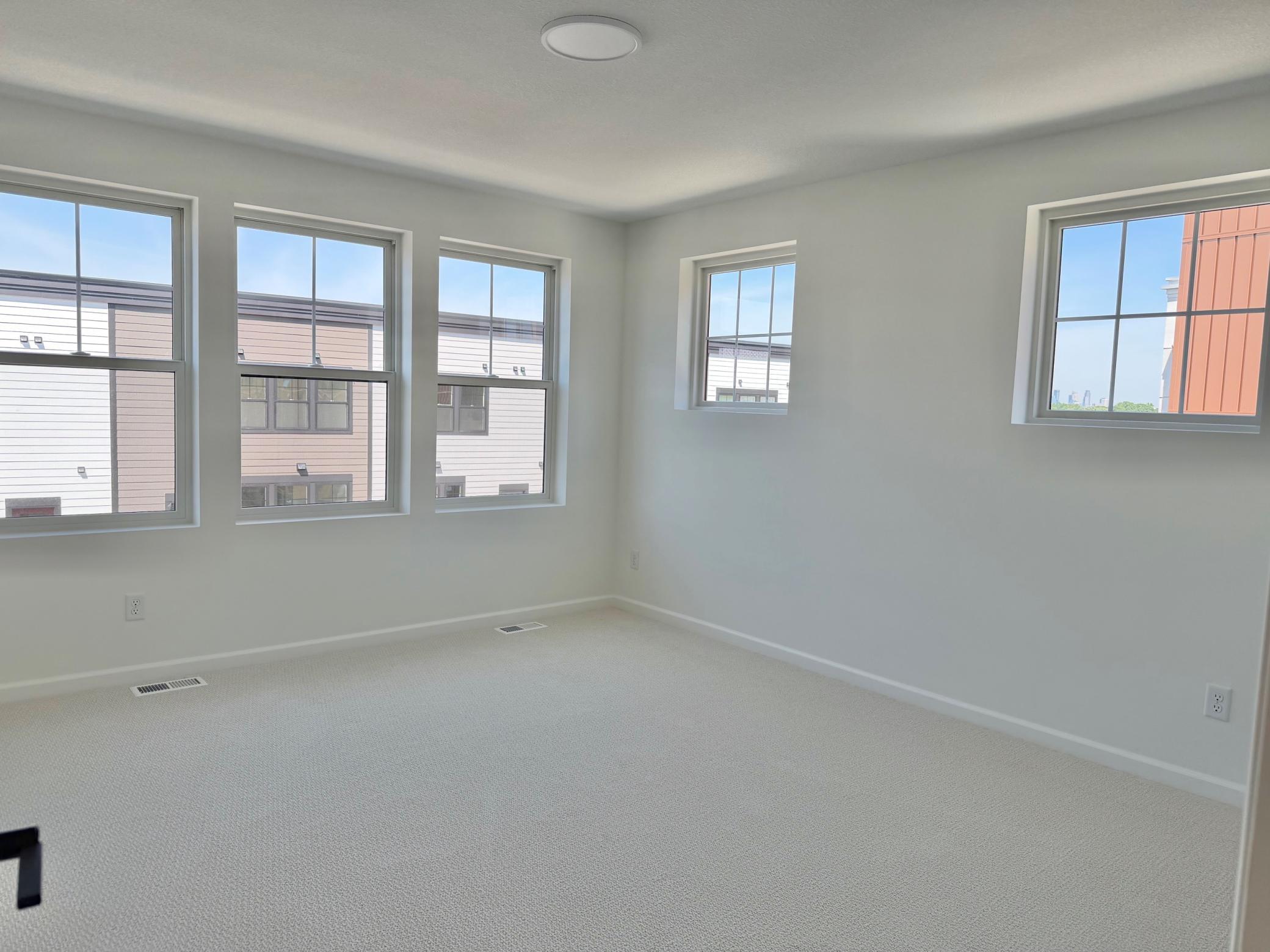 Primary bedroom with ensuite bathroom and 2 closets.