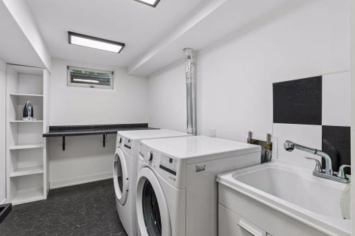 A finished laundry room rounds out the impressive lower level with new washer & dryer and laundry sink