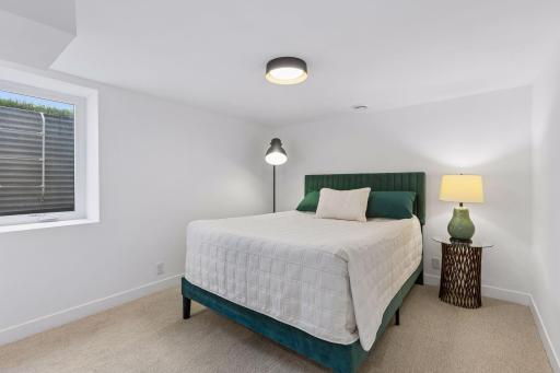 4th bedroom tucked into the back of the lower level would make for a great teen or in-law bedroom