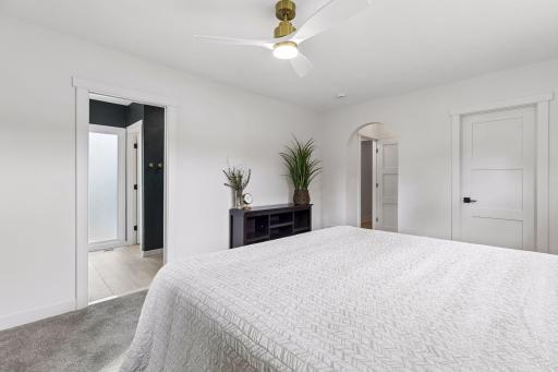 New ceiling fan and glimpse of your new primary ensuite bath to the left and walk-in closet to the right