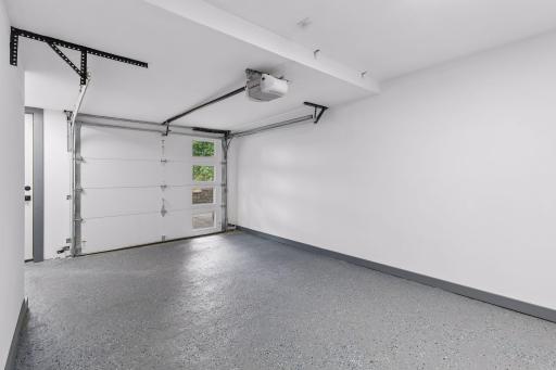 Why not have a finished garage space - all new to you with epoxy style floors, dry walled with new garage and service door - could easily be an extension of your home as a finished space