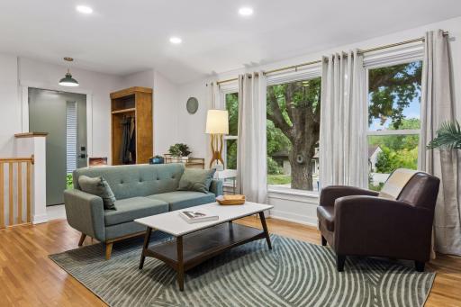 An inviting entryway with custom tree hall welcomes guests