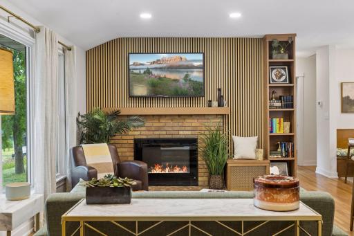 show stopping but not over-the-top with thoughtful updates like a new feature fireplace wall and bookcase blending with the refinished red oak hardwood