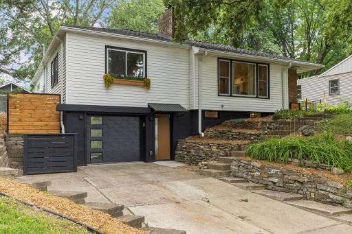 The stylish updates start outside of your new home with a refreshed exterior, new garage and service door and a wonderful blend of mid-century and modern living