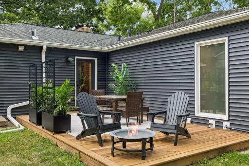 New contrasting vinyl siding creates it's own unique outdoor space sizable enough for a dining and relaxing space