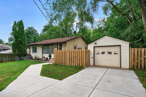 Newer concrete driveway and sidewalk.
