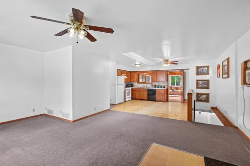 Living room opens into the kitchen
