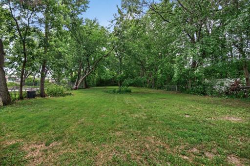 WOW!! Large private fenced in backyard with mature trees.