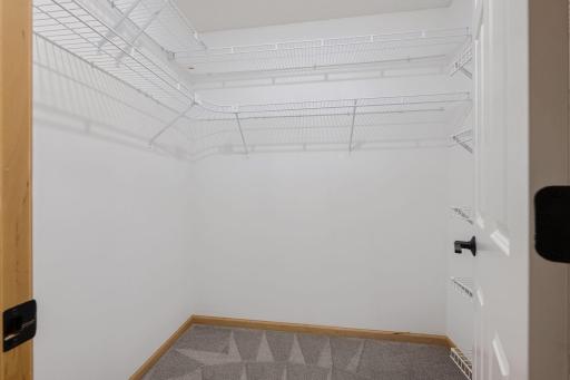 Large walk-in closet with extensive wire shelving for organized storage.