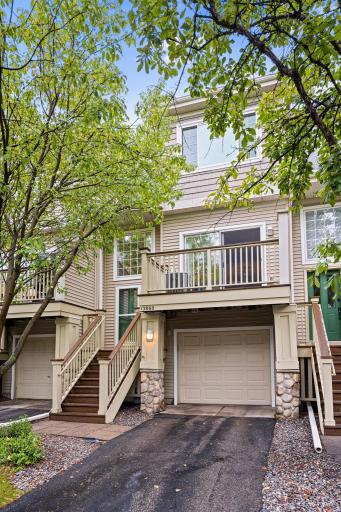 Welcome to 13860 52nd Avenue North, a well-maintained townhome surrounded by mature trees.
