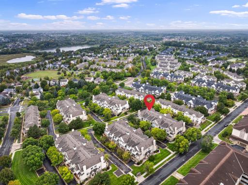 Aerial view showcasing the homeâs location within an established Plymouth neighborhood near green space and nearby lakes. Nearby neighborhood park offers a playground, basketball court, walking paths, and open green space. Aerial view highlighting th