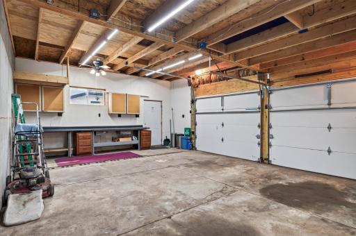 Extended ceiling height on one side to accommodate a car lift.