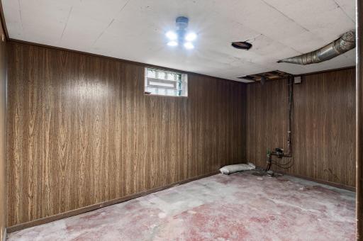 Partially finished 15x11 room could be perfect for office/workout or hobby space.