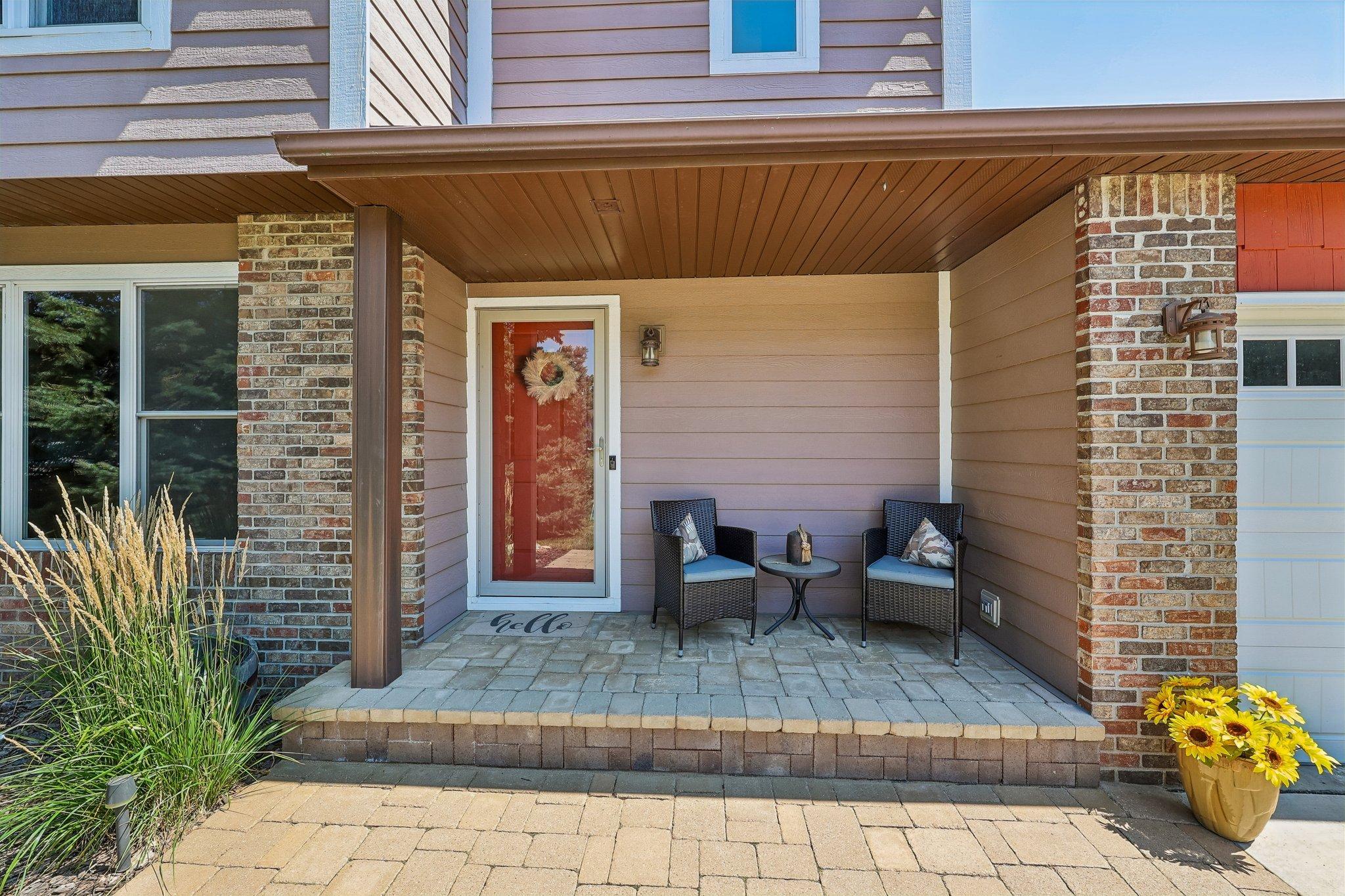 A cozy porch welcomes you home! Enjoy this quiet neighborhood located in a cul de sac from the paver brick front porch.