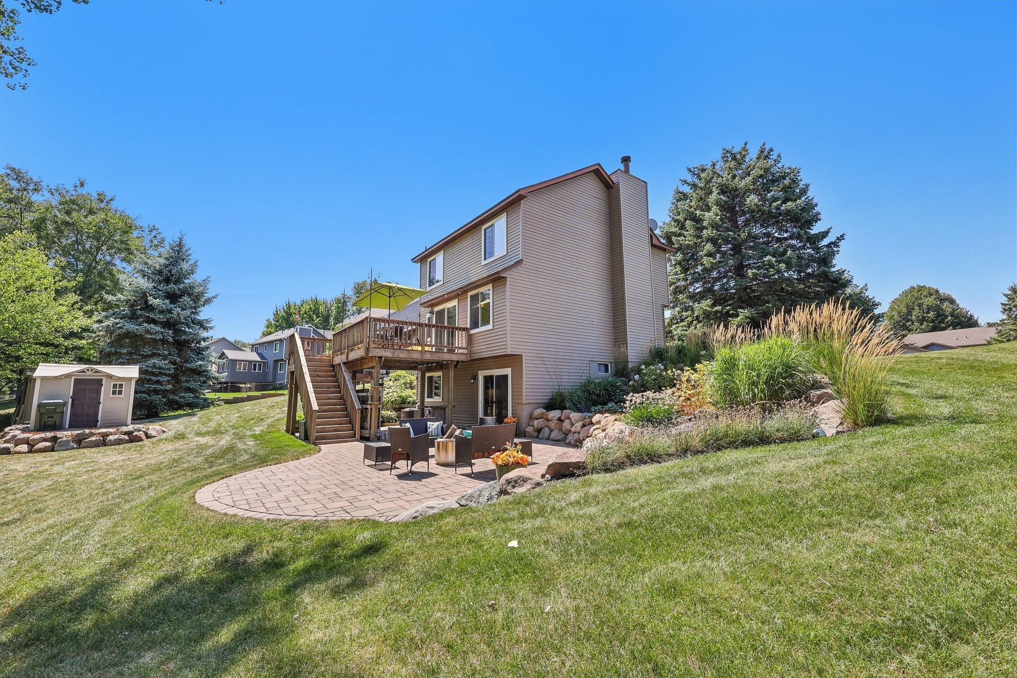 This gorgeous landscaped yard will encourage you to spend more time outdoors.