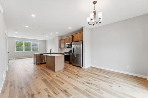 The dedicated dining area can accommodate larger dining sets. Similar home shown, color and options can vary.