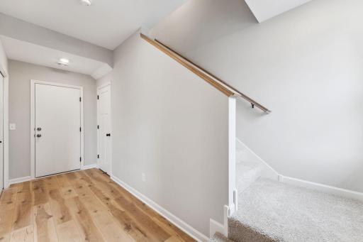 Entry from the garage. Similar home shown, color and options can vary.