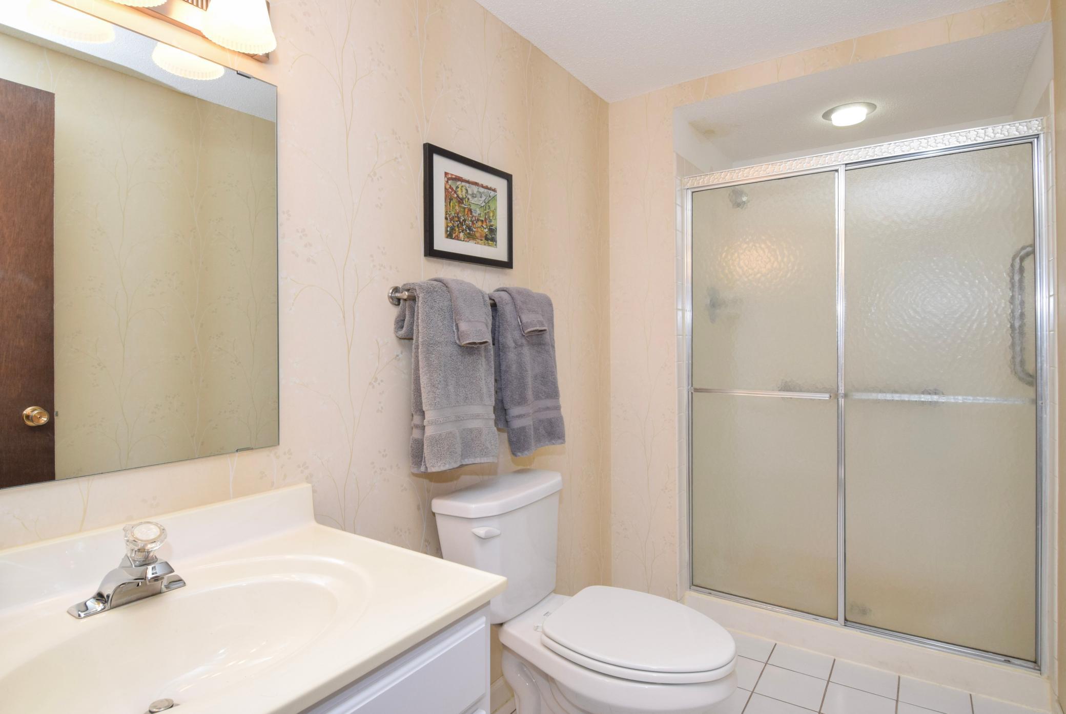 Lower level bathroom also has tiled floors--