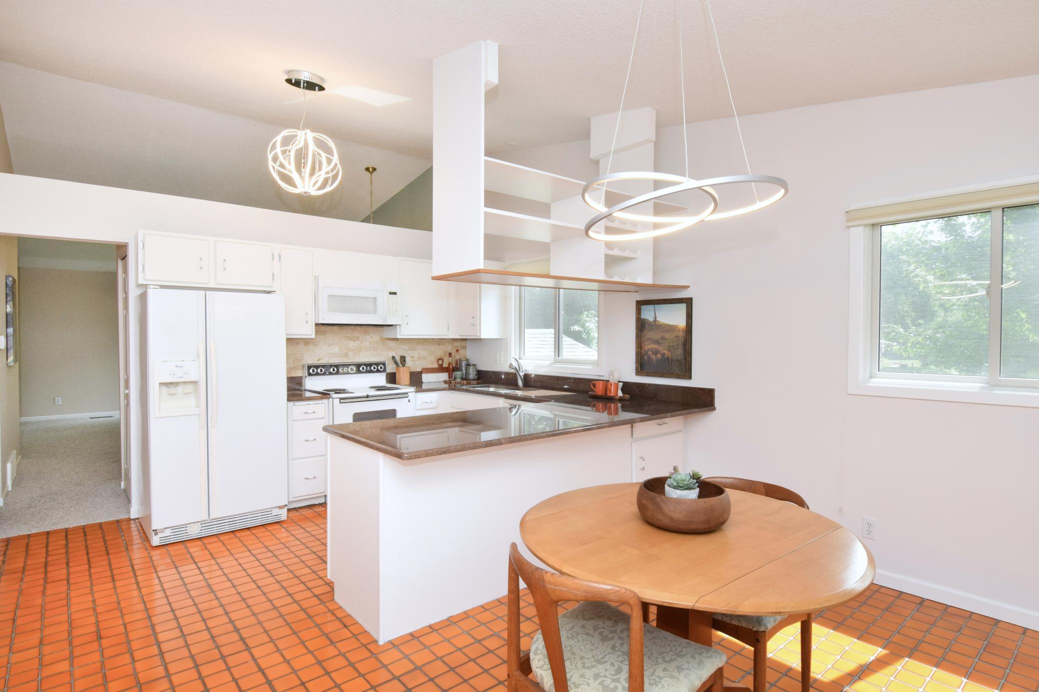 As an end unit, this home offers additional windows that add to the sense of privacy while filling the space with abundant natural light.