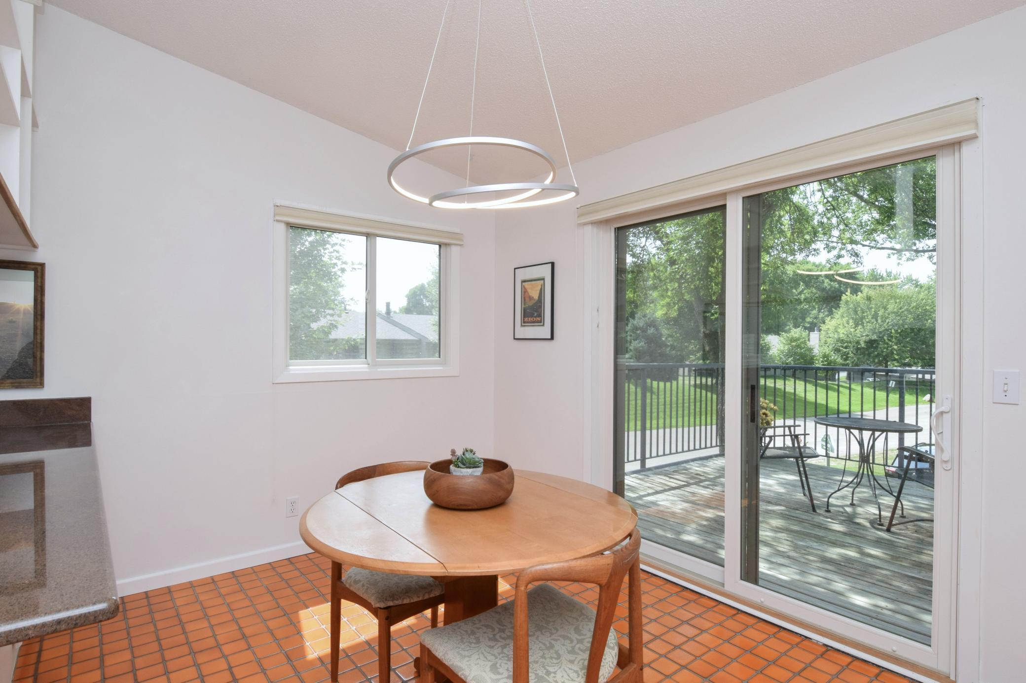 The vauted ceiling extends to the kitchen & dining areas.