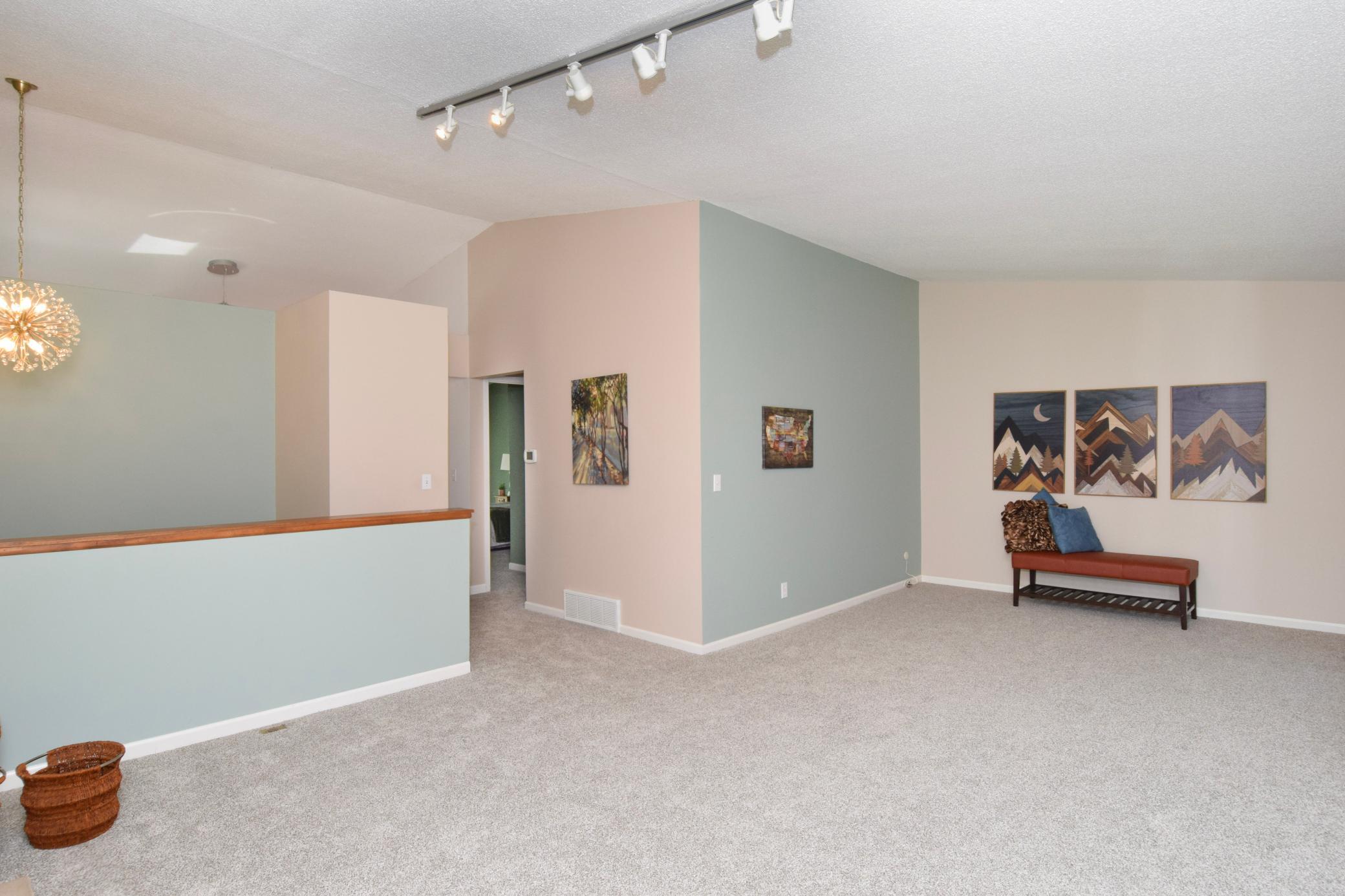 The spacious living room offers flexible furniture placement options, making it easy to create a layout that suits your style while providing plenty of room for entertaining guests.