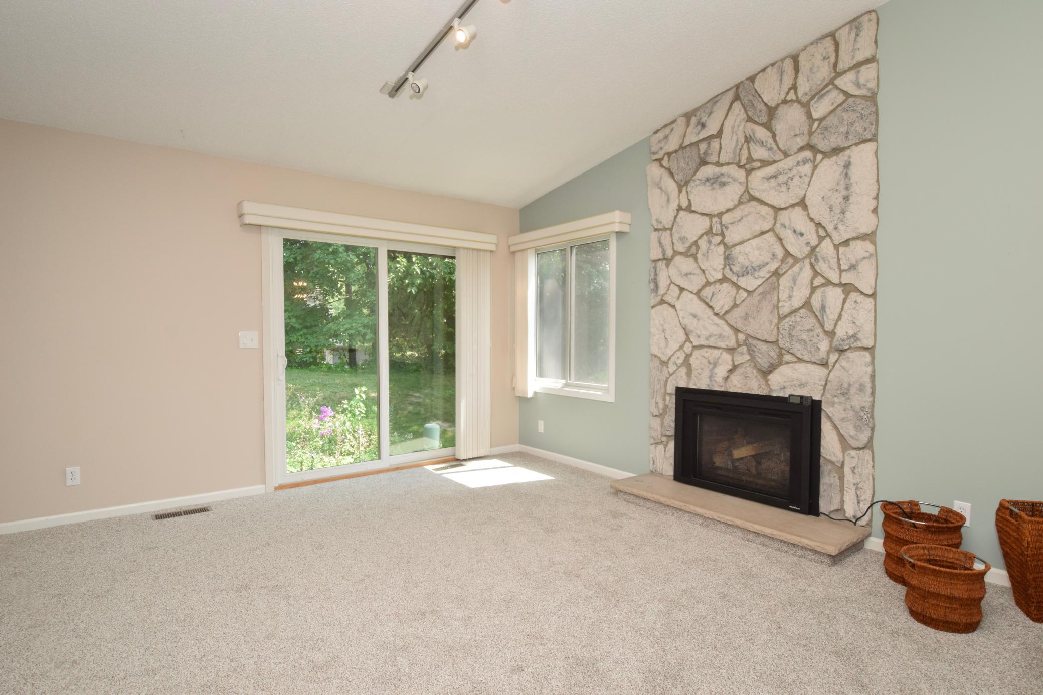 The sliding door accesses the patio area & pretty view!