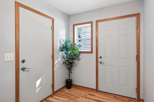 Garage door to the left and entry door to the right.