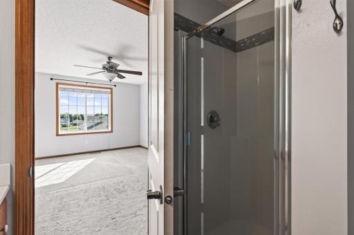 Ensuite bathroom has separate shower and tub.
