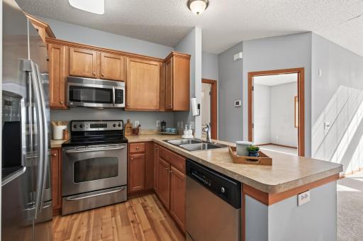 Kitchen has all stainless steel appliances.