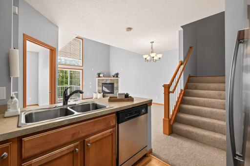 Kitchen looks into dining room and living room.