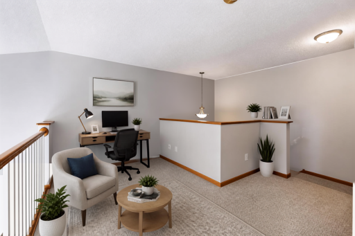Upper level loft outside of the primary bedroom could have many uses. (Virtually Staged)