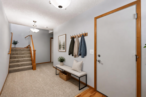 Very large entry area that has access to garage, large closet, and laundry/mechanical room. (Virtually staged)
