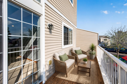 Deck off the living room. (Virtually Staged)