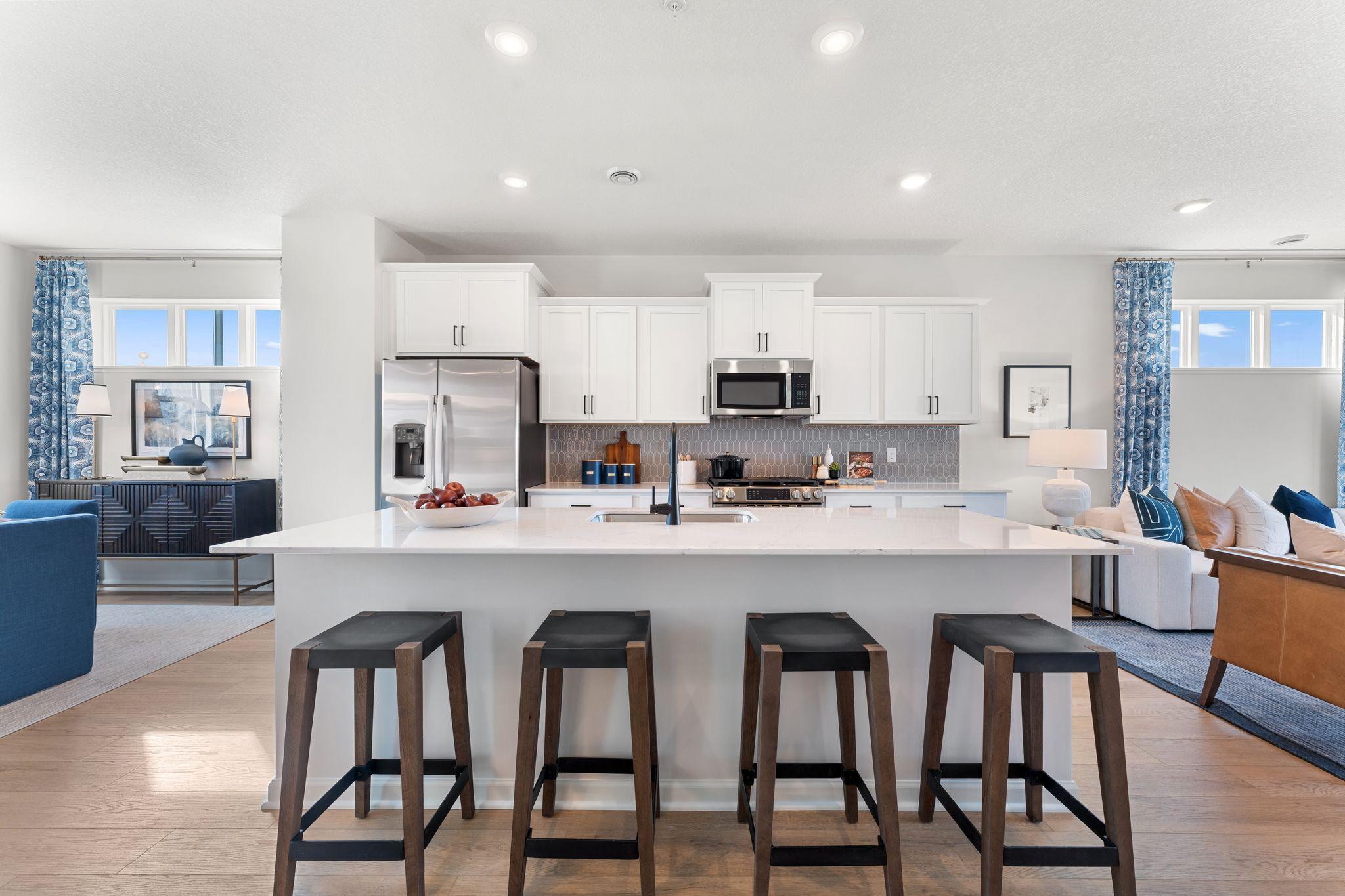 The kitchen has timeless finishes that blend an elevated feel with functionality. Similar home shown, see last photo for the interior selections.