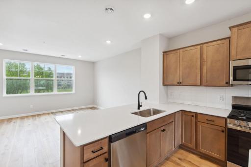The breakfast bar is the perfect spot for a casual meal. Similar home shown, color and options can vary.