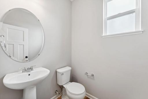 Convenient powder room located off the kitchen.