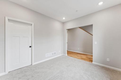 From the garage entry is the multi purpose rec room perfect for a home office, gym, lounge or play area. Similar home shown, color and options can vary.