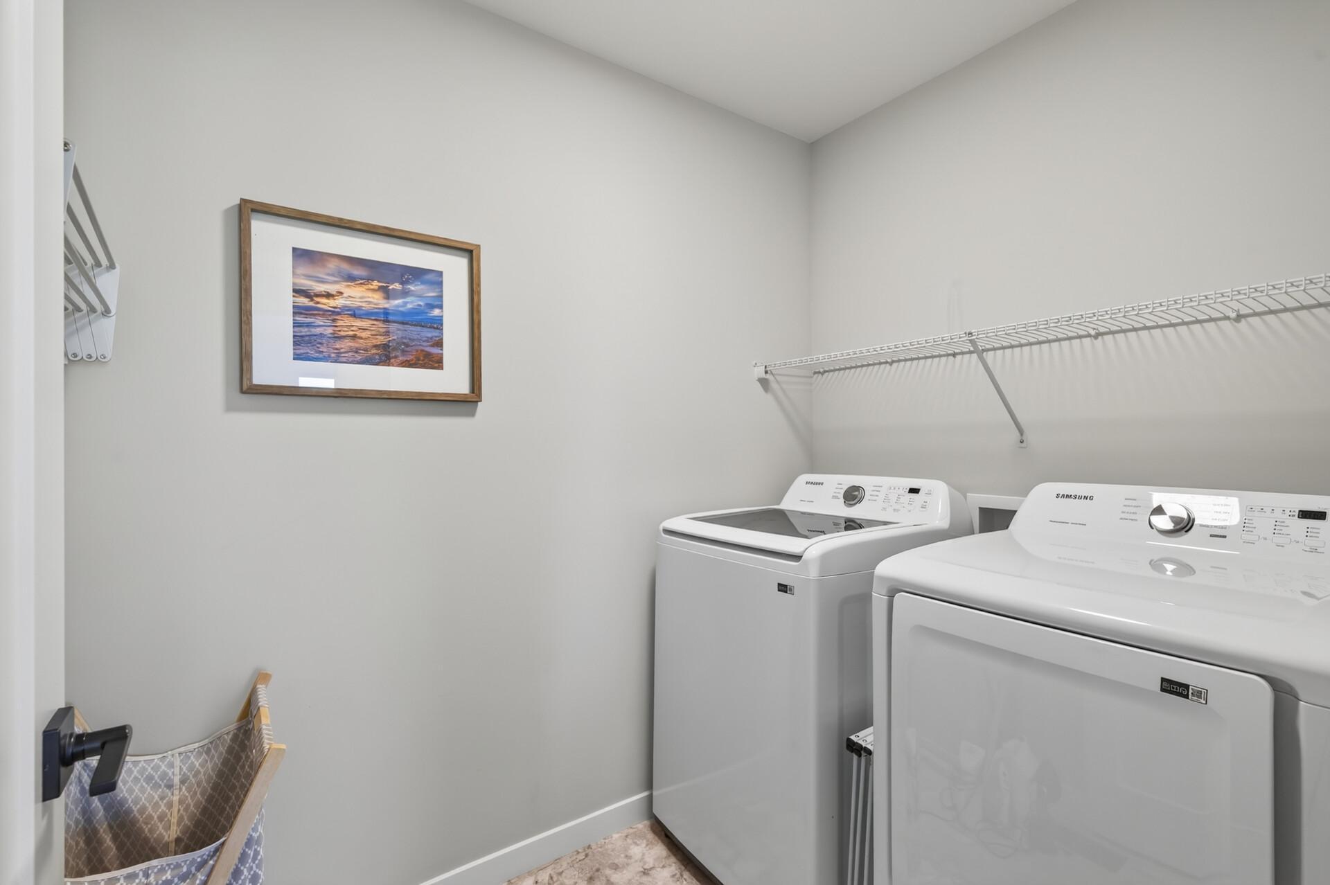 Laundry conveniently located outside the three upper level bedrooms