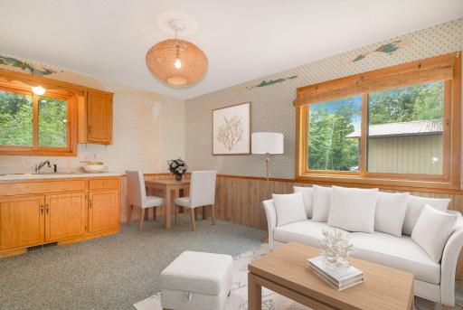 Virtually staged sun room perfect for a guest suite, additional living area for entertaining!