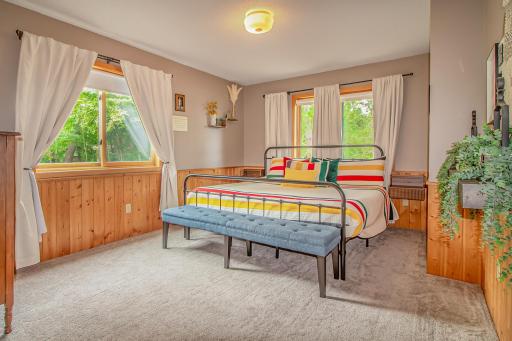Primary bedroom suite on main level with two walk in closets and an abundance of natural light!