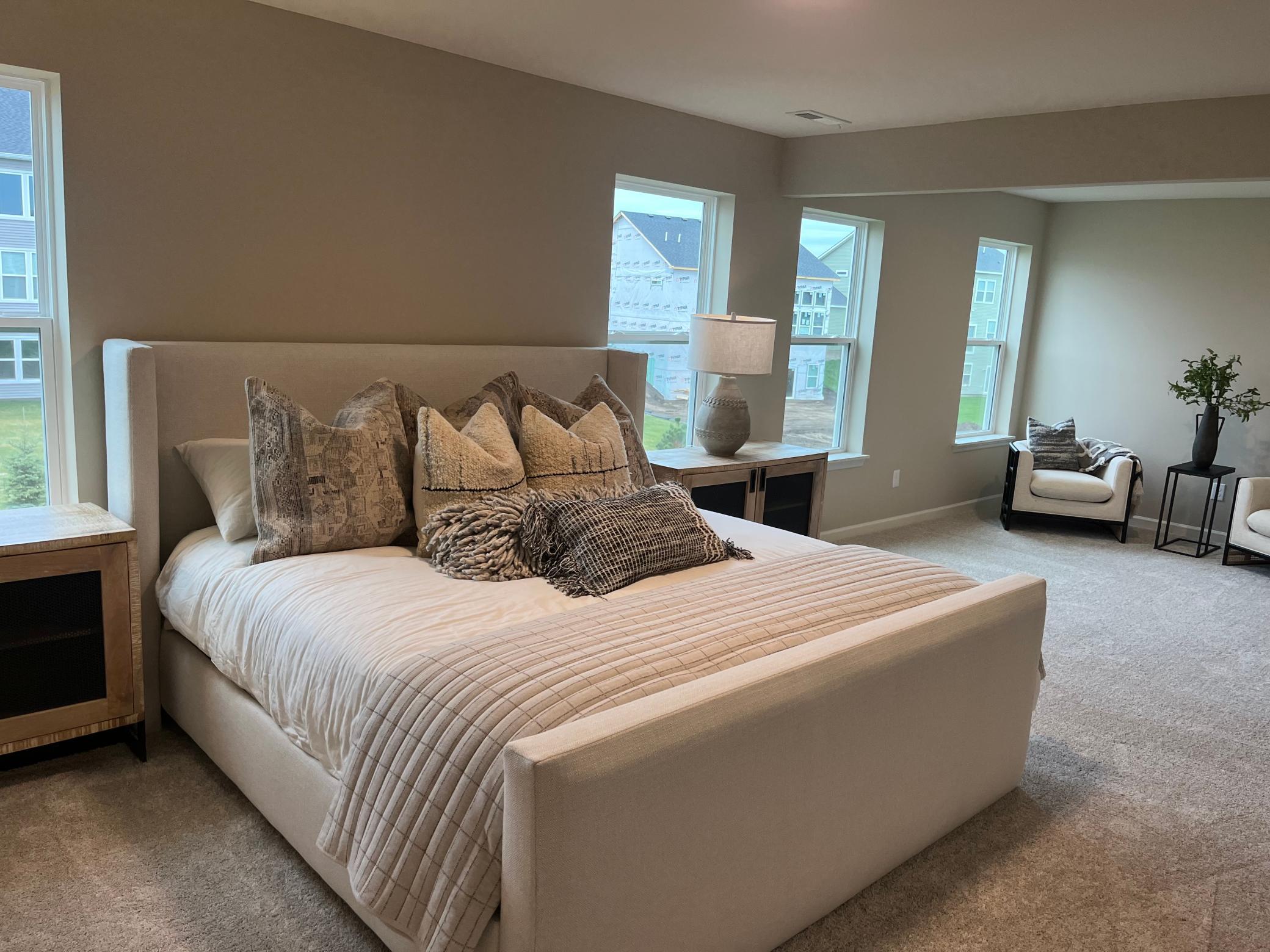 Same floorplan - staged. Primary bedroom with lots of natural light