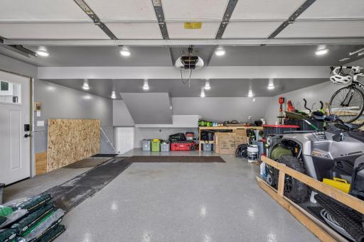 The Attached Garage Features A Professional Epoxy Floor Designed For Easy Maintenance