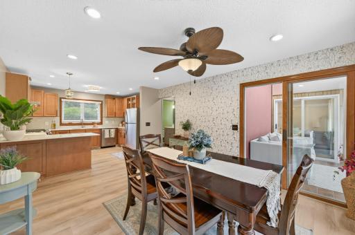 Dining room leads to the sunroom and deck.