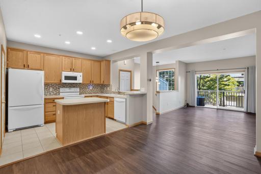 Bright main-level living spaces feature updated flooring, lighting and fresh paint.