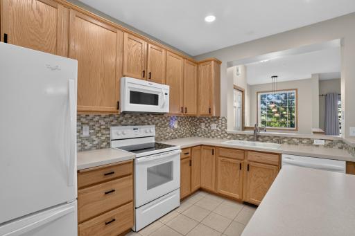 Tiled backsplash adds a polished finishing touch to the kitchen.