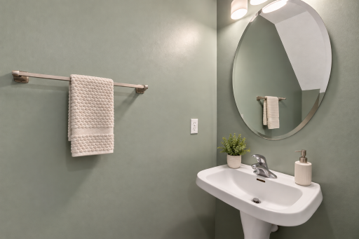 Main-level half bath adds everyday convenience.
