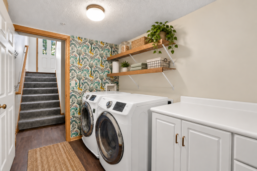 Laundry area is conveniently located on the lower level near the garage entrance.